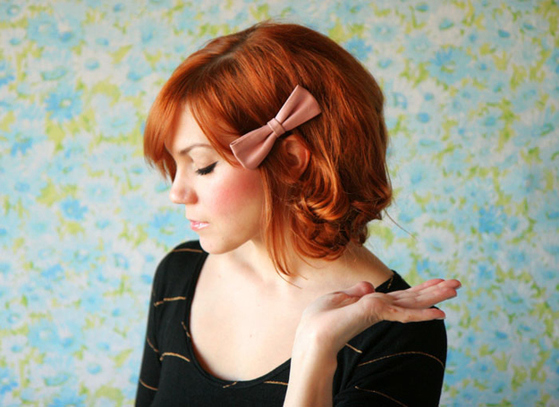 Style your hair with a sweet bow and curls.